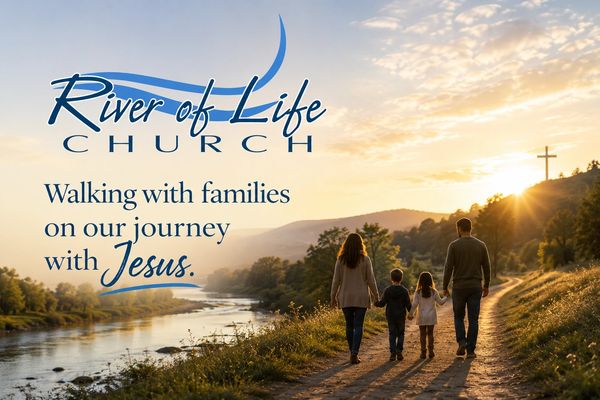 Family walking by a river at sunset with a church cross in the background.