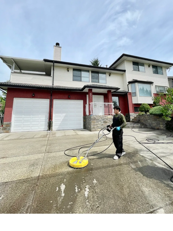 Fresh Pressure Washing Vancouver technician using professional pressure washer concrete driveway. 