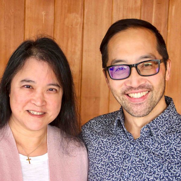 Einer and Laura Teng at the church smiling for their headshot photos 