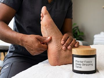 Therapist performing plantar fascia deep stripping massage.