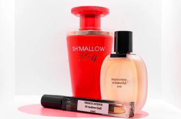 Three perfume bottles with different designs and colors.