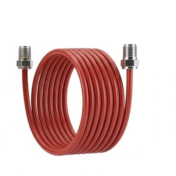 Coiled red copper tubing with metal fittings on both ends.