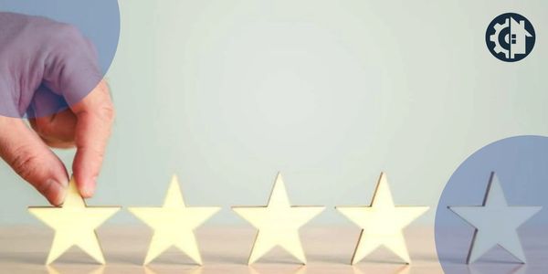 Hand placing a star among a row of four stars and one empty spot.