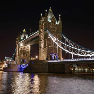 Tower Bridge in London illuminated beautifully at night.