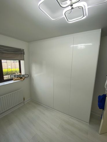 Gloss white fitted wardrobe