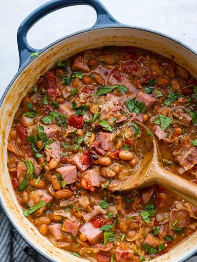 Hearty bean and ham stew in a pot.