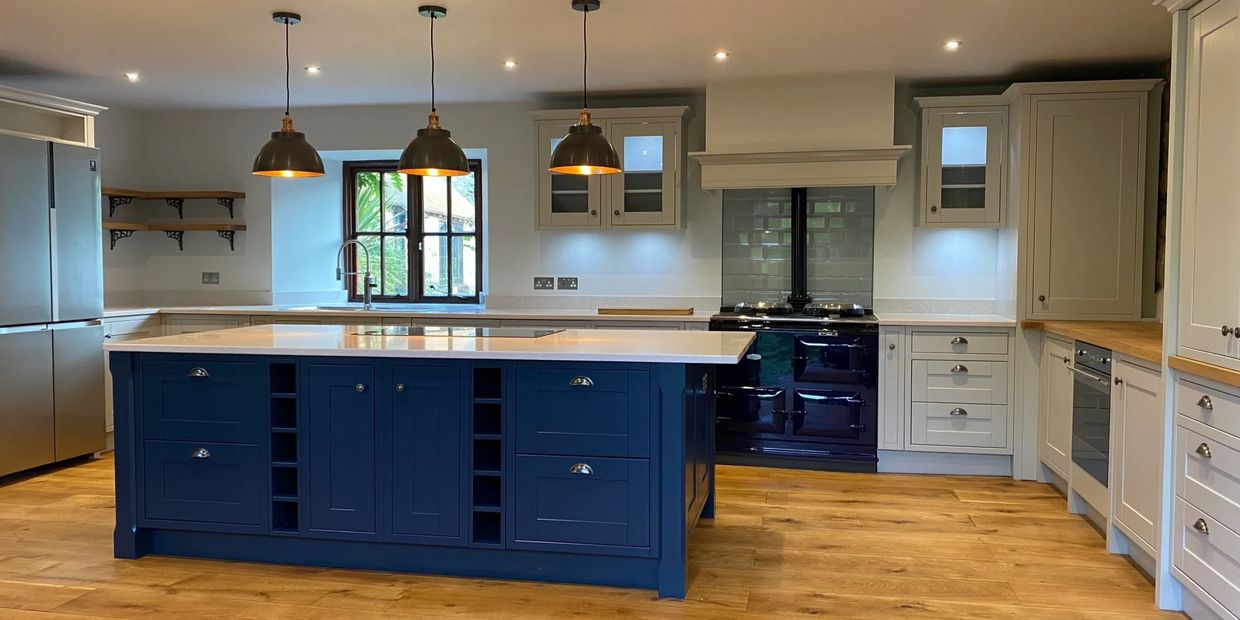 Traditional bespoke kitchen in barn conversion painted in Farrow and Ball colours