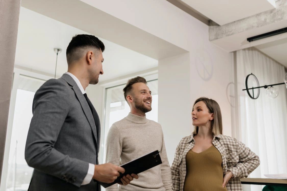 A couple visiting the property with a realtor post estate cleanout