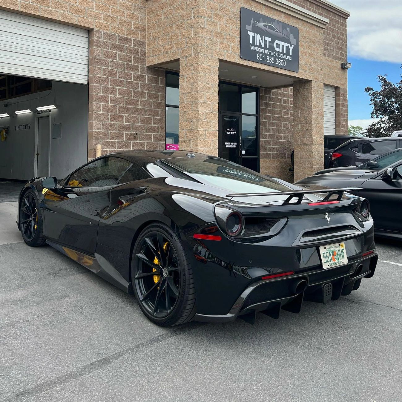Black Ferrari with paint protection film and window tint outside Tint Citi West Valley City
