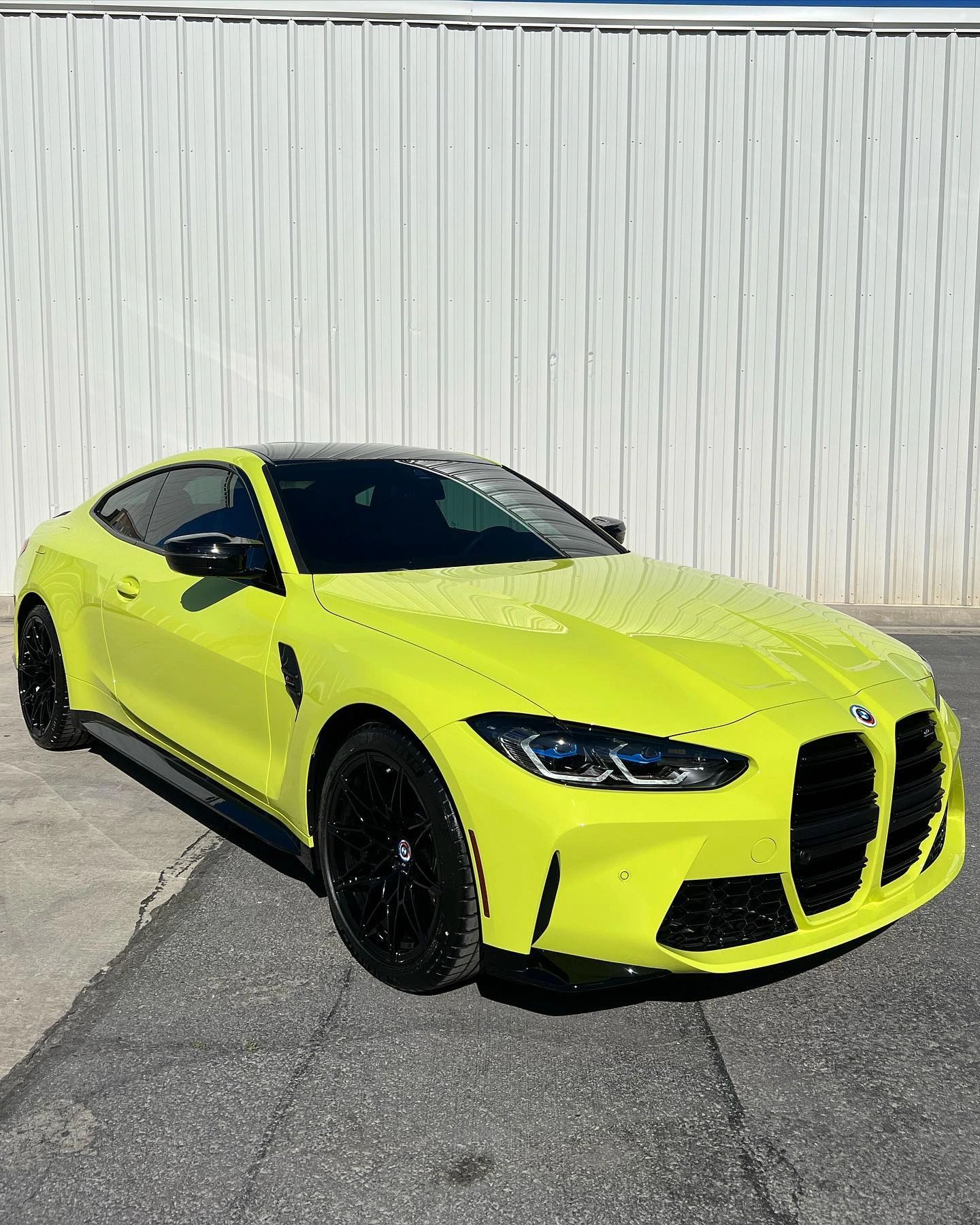 BMW finished in a color-change vinyl wrap outside Tint Citi