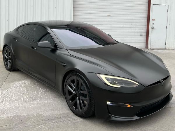 tesla with matte black vinyl wrap