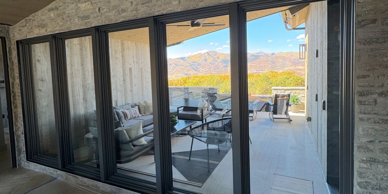 A picture of a house in Park City Utah with window tint installed reflecting the mountains