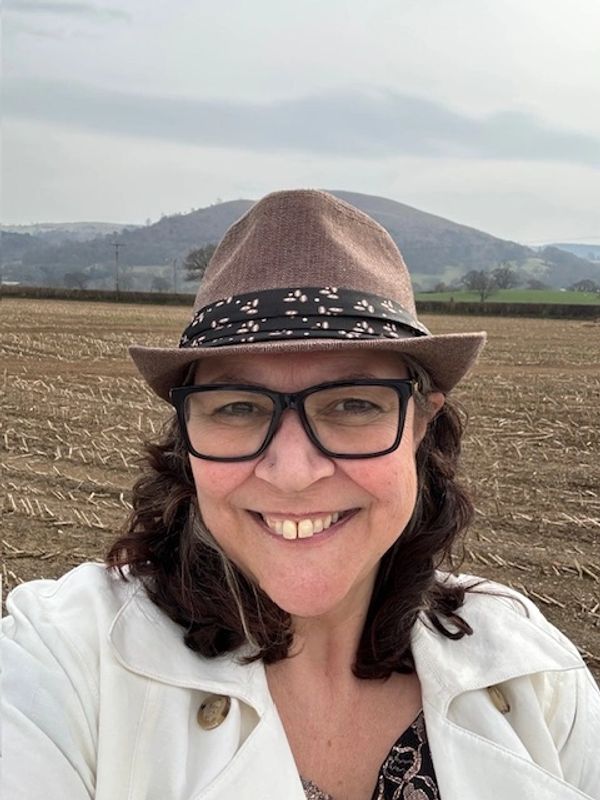 Female psychotherapist, kind, smiling in nature. 