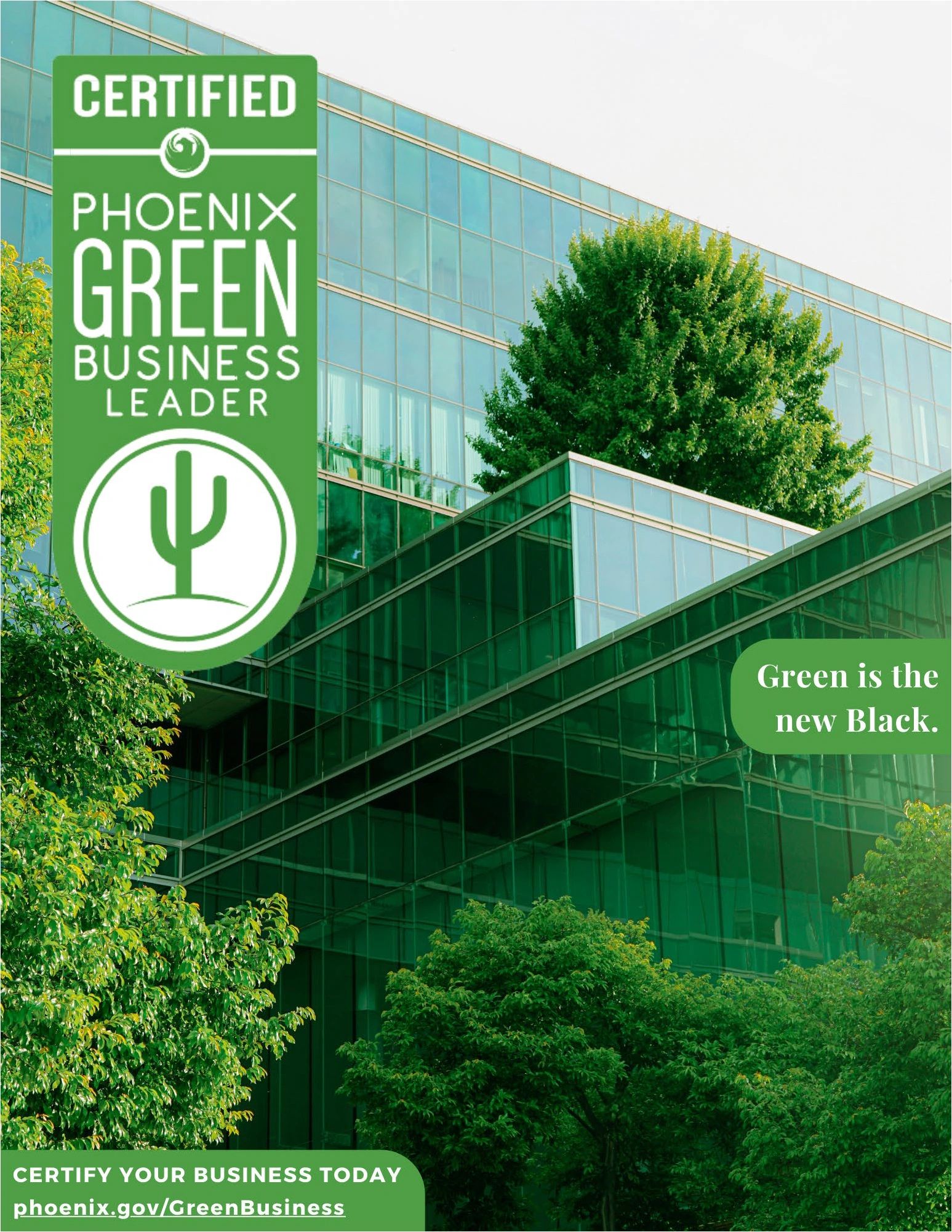 Modern green-certified office building surrounded by lush trees.