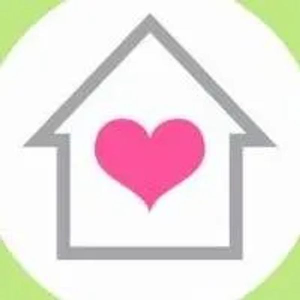 House outline with a pink heart inside representing love at home.