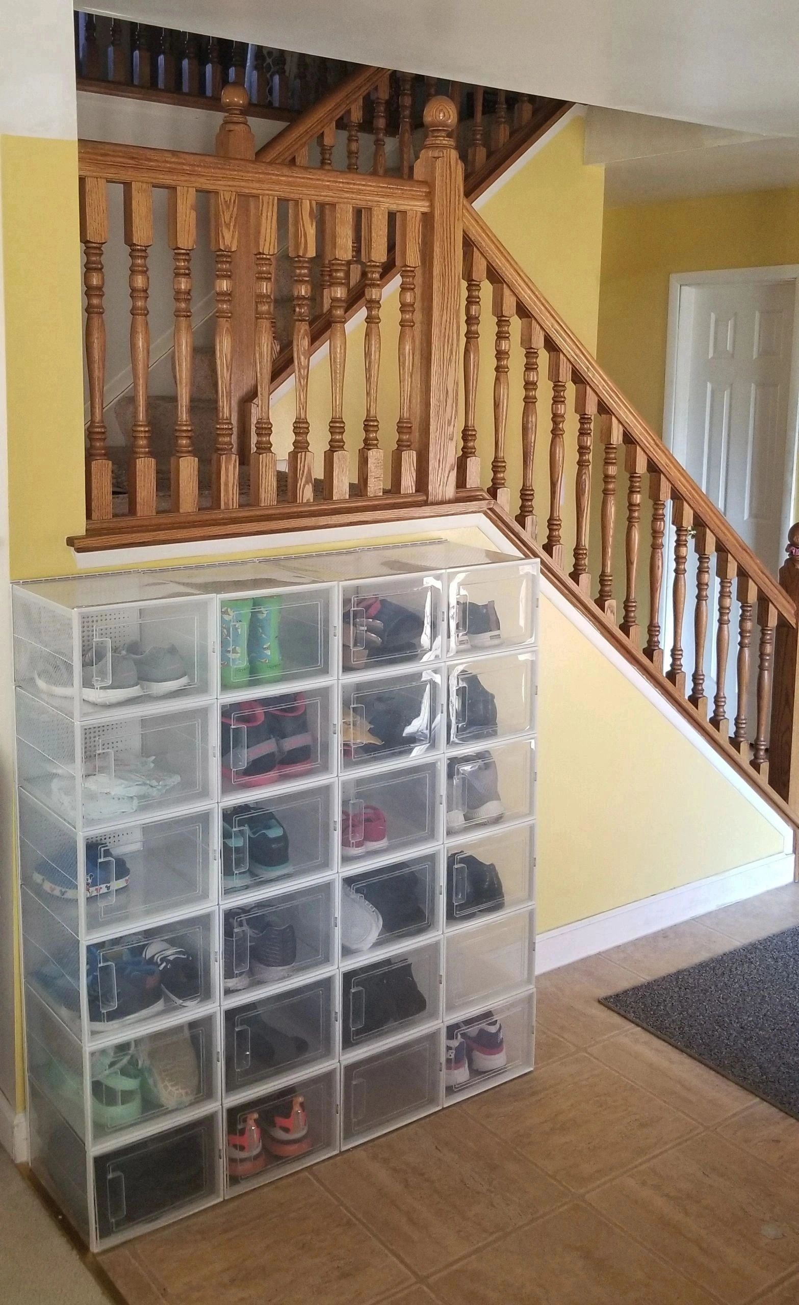 shoe boxes in the hallway by the stairs