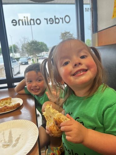 Kids enjoying the Dill Pickle Pizza