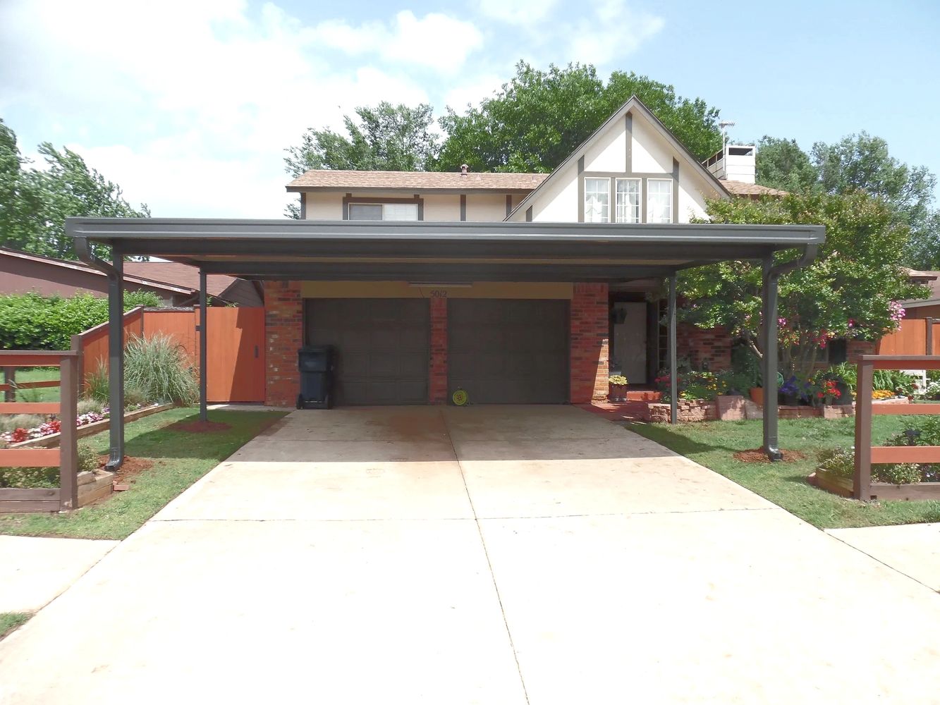 24ft x 20ft attached rolled formed aluminum flat-pan carport 2-1/2-car wide  Bronze/Ivory pans MWC