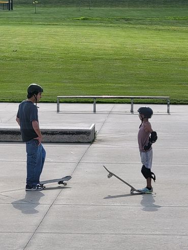 Skate Lessons Chicago at Roselle Park District Skateboarding Lessons a coach and student talking