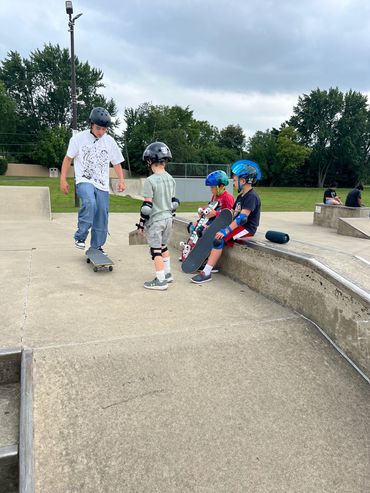 Skate Lessons Chicago coach with students at Roselle Park District skateboarding lessons