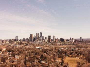 Aerial drone photo of the city of Minneapolis in Minnesota during the winter with brown trees.