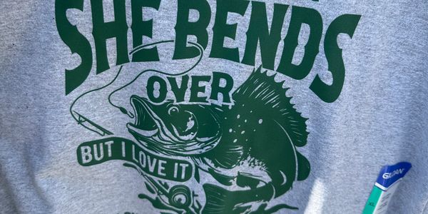 Gray T-shirt with a fishing-themed humorous message and fish graphic.