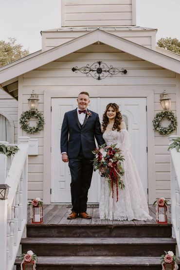 Newlywed couple smiling together in elegant wedding attire