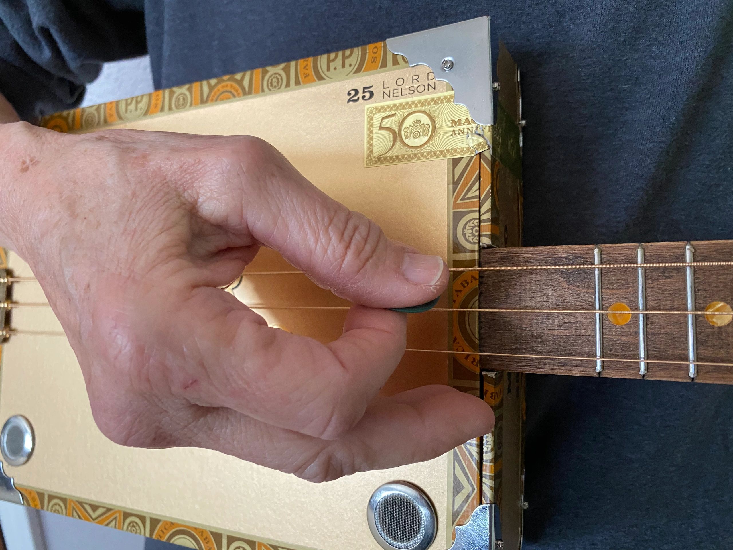 Picking on a 3-String cigar Box Guitar