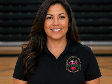 Smiling woman in a Pasco Lady basketball polo shirt.