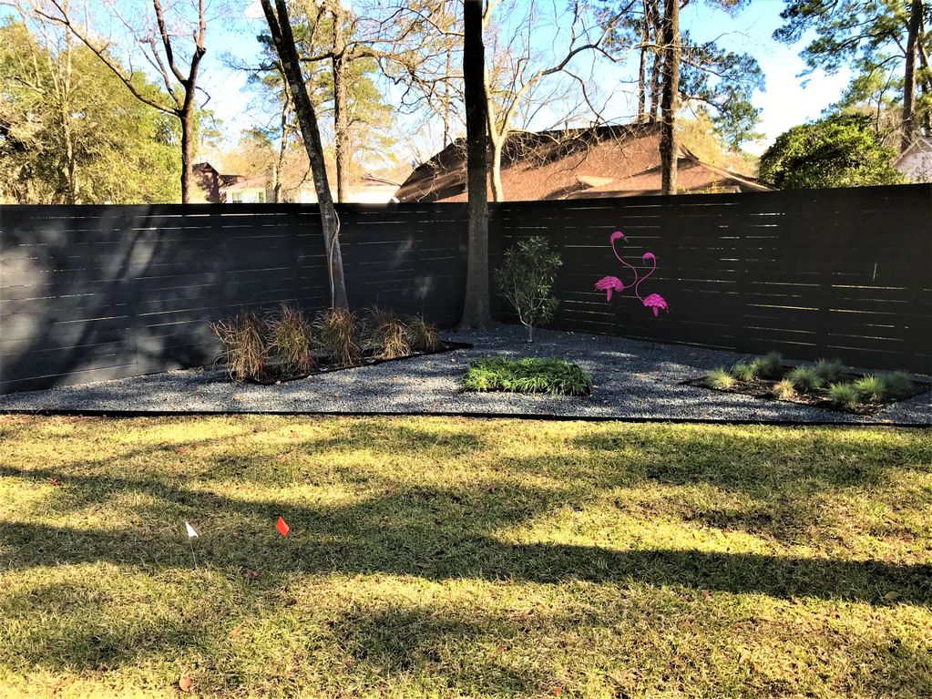 Black Horizontal Privacy Fence. Stained Wood Fence. Treated Pine Lumber.