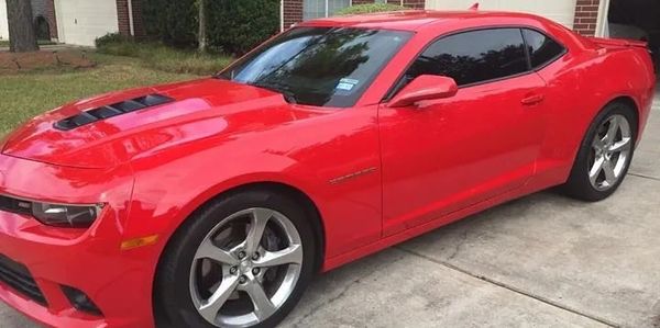 Red sports car in driveway