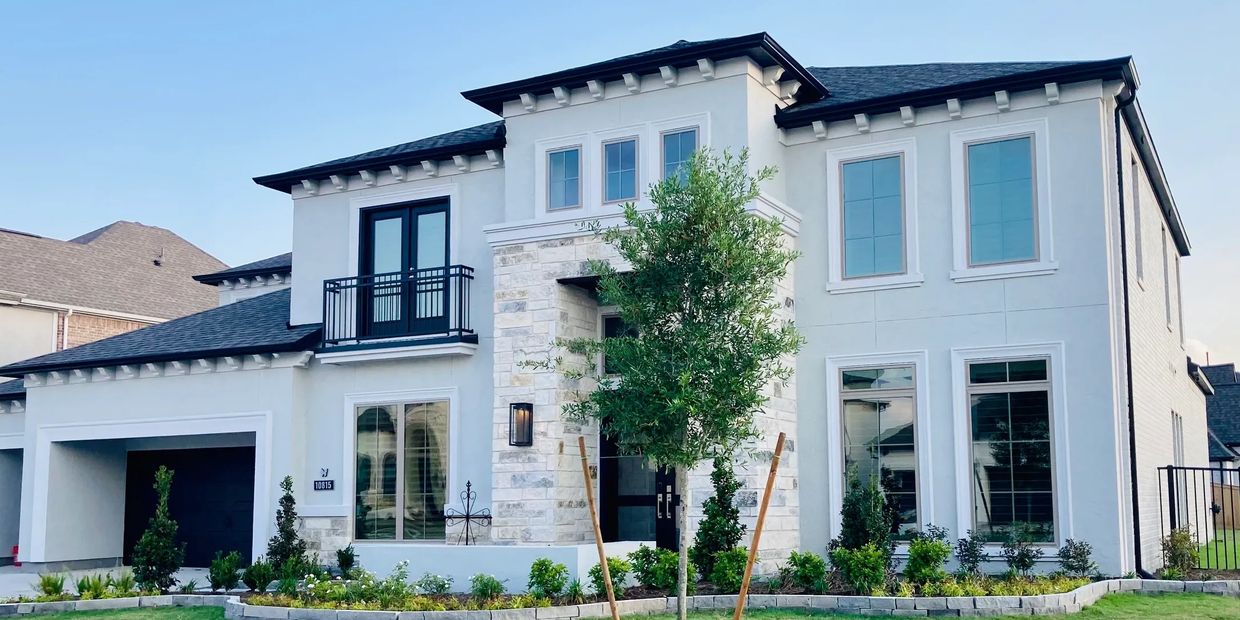 White two story home with tinted windows