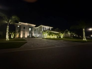Luxurious house illuminated at night.