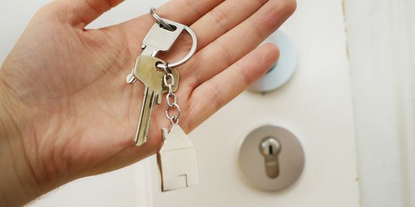 Real estate agent holding the keys to a new property