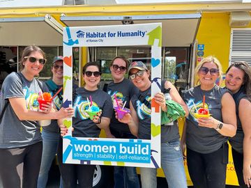 group of people smiling and eating snow cones. corporate service.