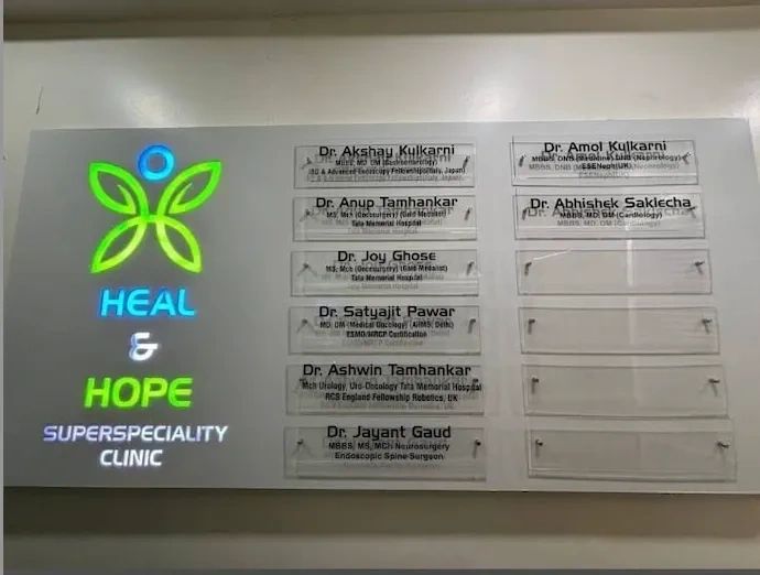 Clinic board displaying names and specialties of doctors at Heal & Hope Superspeciality Clinic.