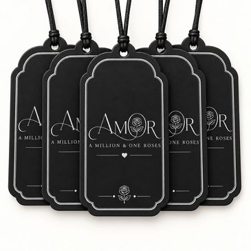Black Amor branded tags with strings.
