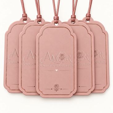 Pink gift tags with 'AMOR' embossed.