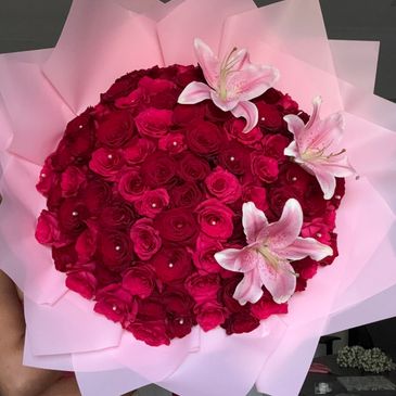 Bouquet of red roses with pink lilies.