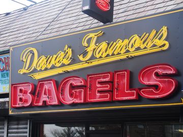 A neon open lit Channel Letters sign of a restaurant 