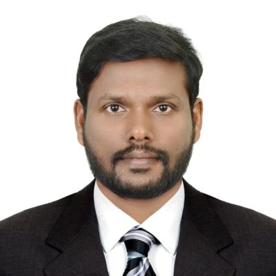 Professional headshot of a man in a suit and tie.