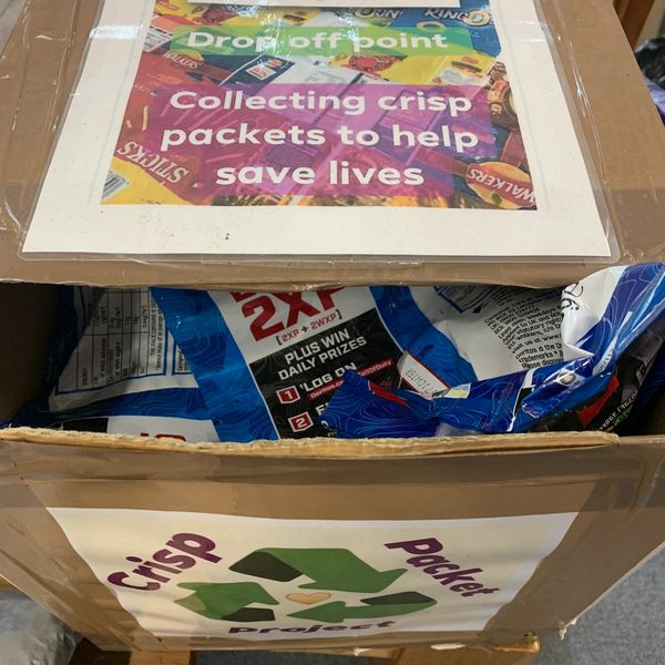 Box labeled for collecting crisp packets to help save lives.