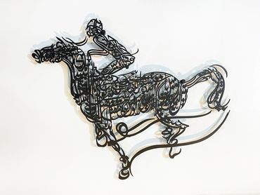 Calligraphic laser-cut metal relief sculpture by Khalil Chishtee, depicting a man riding a horse.