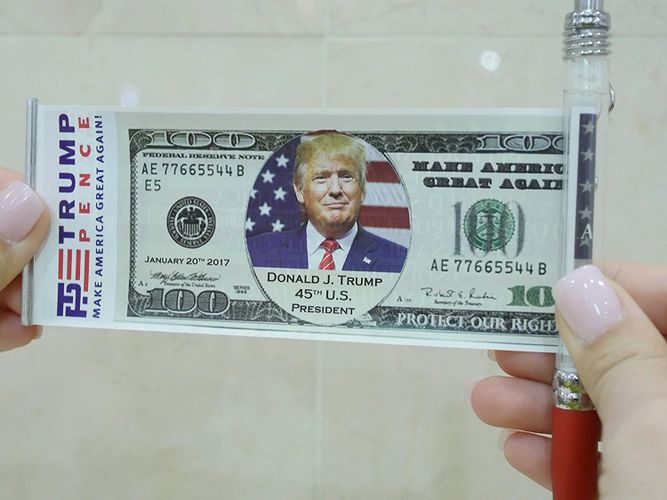 Plastic banner flag pen with Donald Trump, the 45th President on a 100 dollar bill the front.