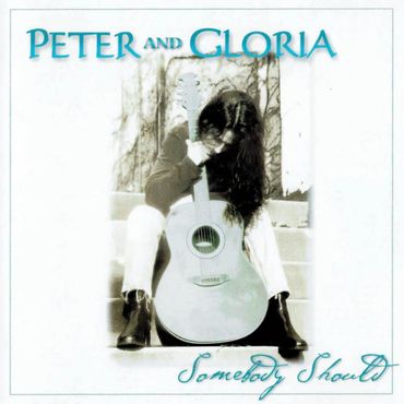 Album cover of Peter and Gloria with a person holding an acoustic guitar.