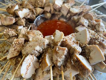 Transport to the islands with this tropical feast! Savor grilled chicken skewers glazed with honey a