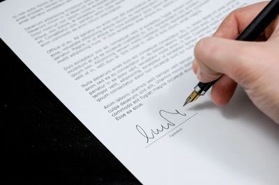 Person signing legal contract