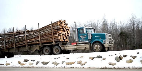 Truck hauling timbers