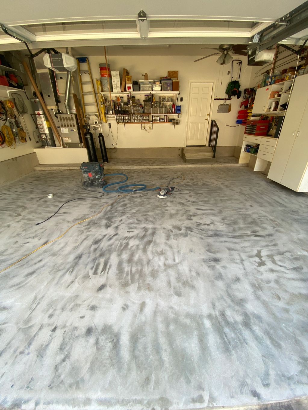 A clean and organized garage with tools and equipment.