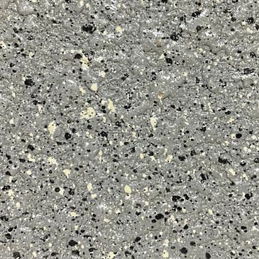 Close-up of a speckled gray terrazzo surface with black and white chips.